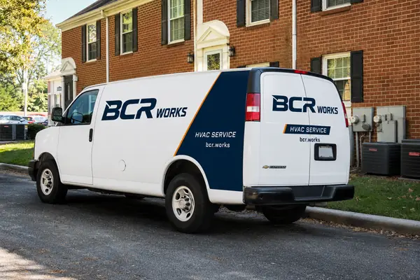BCR Works HVAC service van parked outside a residential property.
